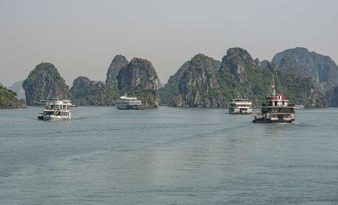 Ha Long Bay boats and limestone pillars